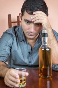 Depressed and drunk hispanic man